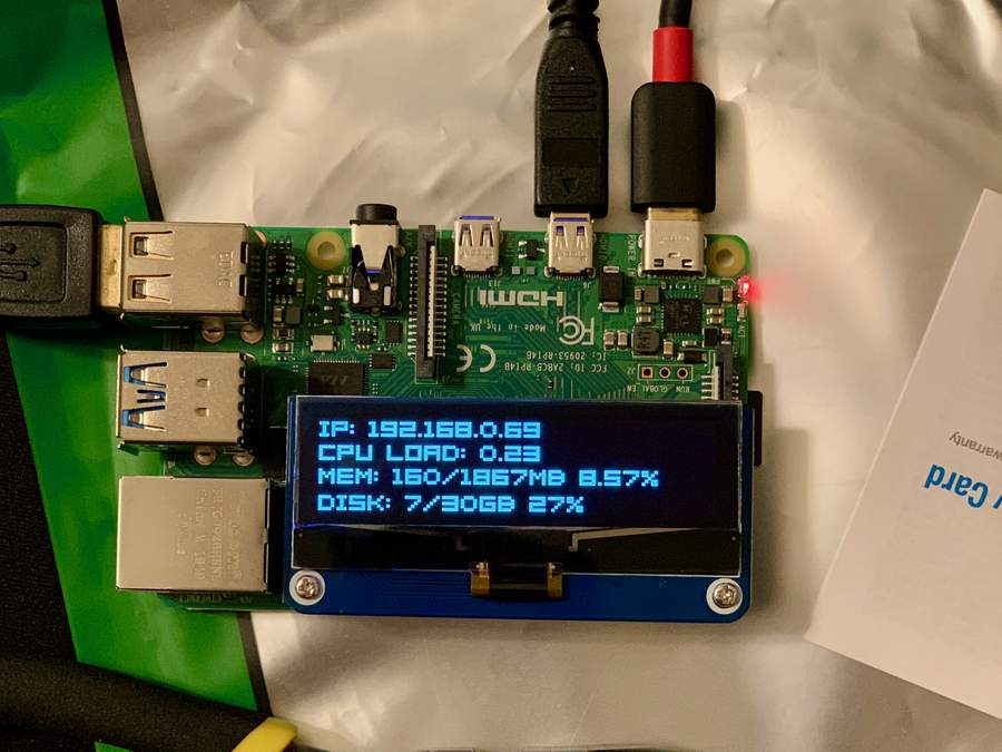 Pi with OLED HAT running demo code.